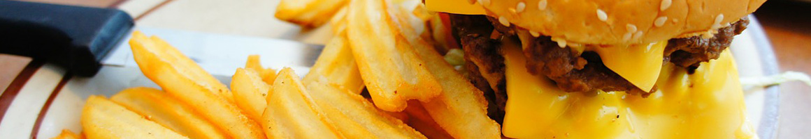 Eating Burger at Little Bitty Burger Barn restaurant in Houston, TX.